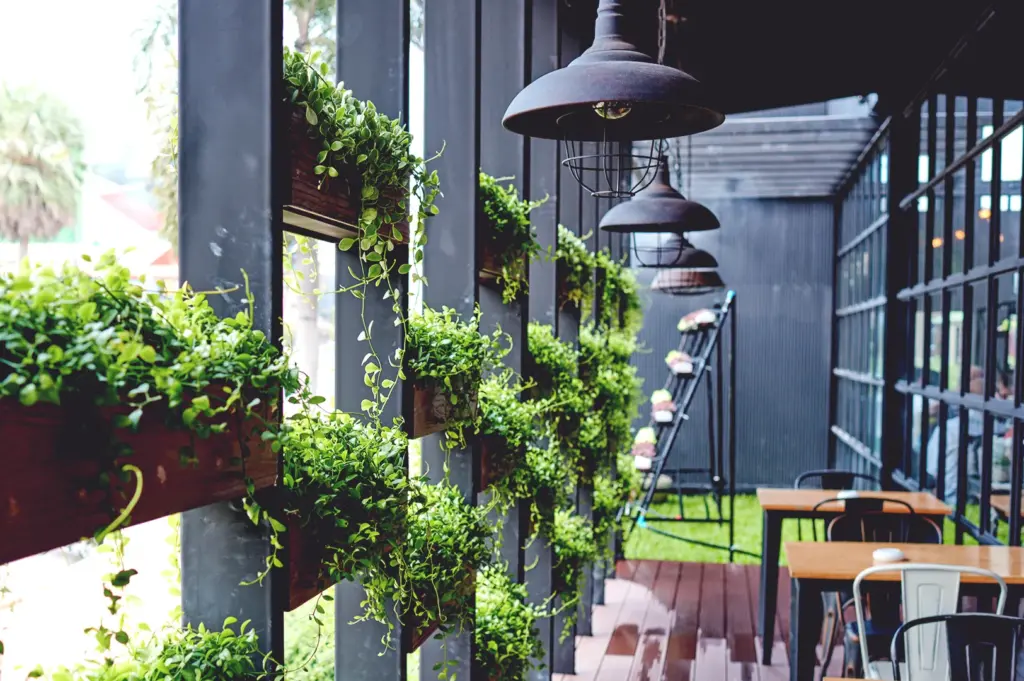 Cozy cafe terrace with vertical garden and greenery in Singapore