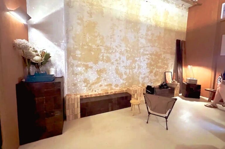 174BINGO Singapore interior with warm lighting, textured walls, and minimal seating reflecting quiet and intimate cafe atmosphere