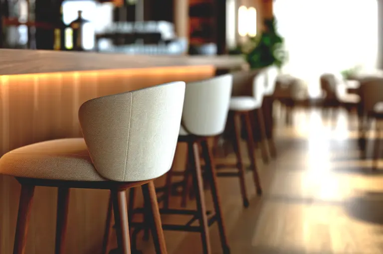 Empty cafe bar seating in Singapore with soft natural light and minimalist interior showing calm atmosphere after peak hours