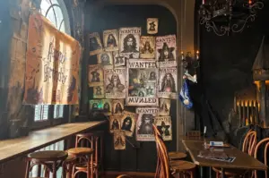 The Wizard's Brew, Singapore. A fantasy-themed cafe interior with a wall of posters.