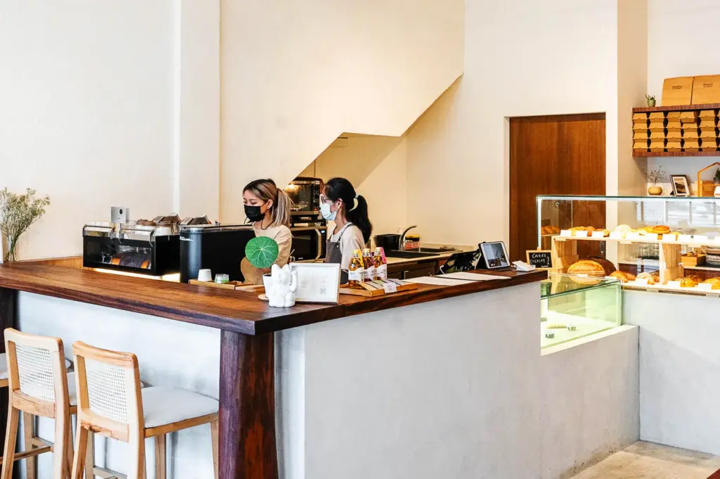 Minimalist Singapore cafe counter with wooden