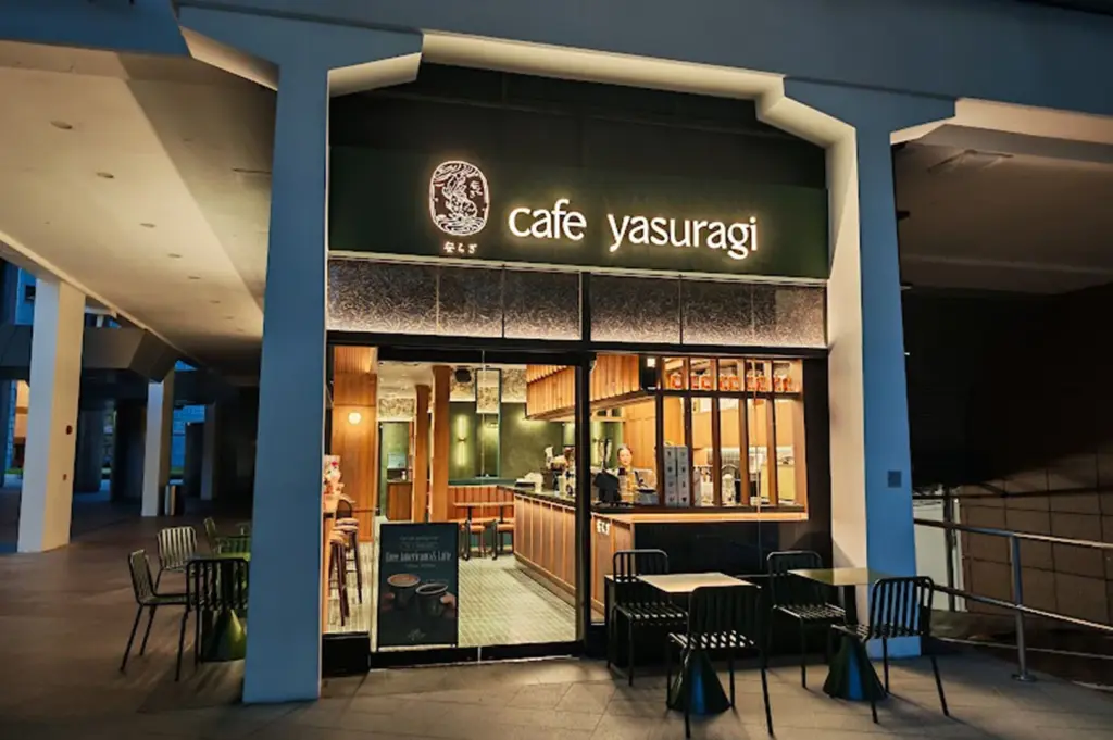 Cafe Yasuragi storefront at night.