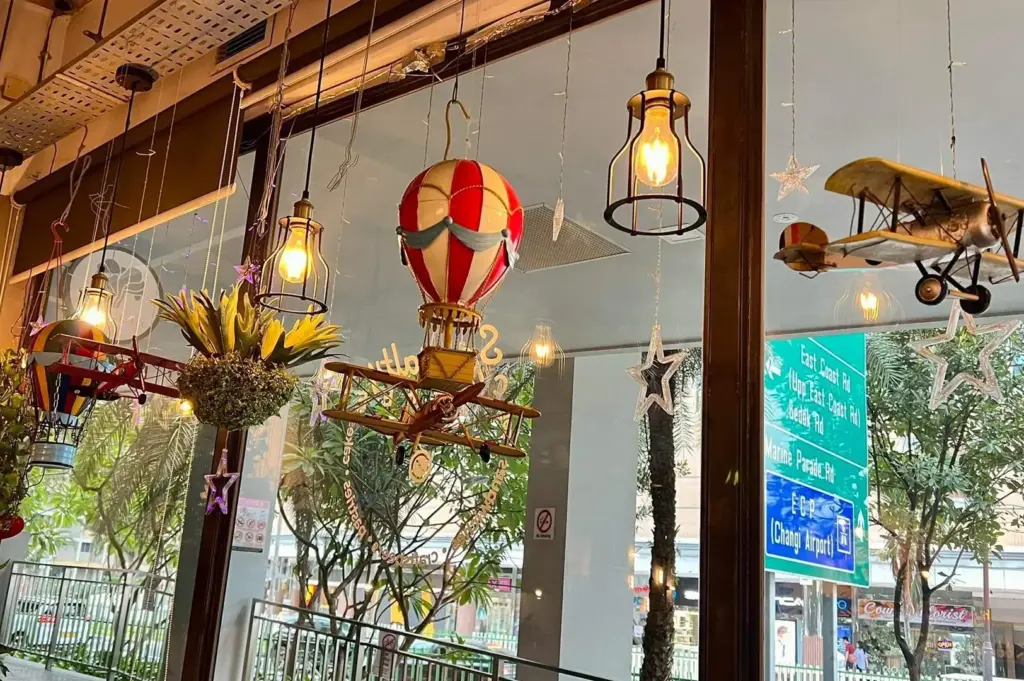 Hanging decorative lights with hot air balloon and vintage plane ornaments